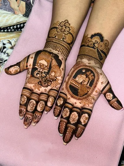 A unique design featuring a lotus and a palace scene on one hand, with a peacock on the other. It shows how we can mix and match different traditional elements.