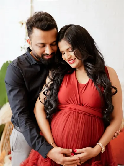 A loving embrace between partners. This photo captures the joy and anticipation on their faces as they look forward to meeting their baby.