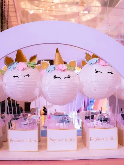 The custom-built cart holding all the adorable unicorn-themed return gifts for the party guests.