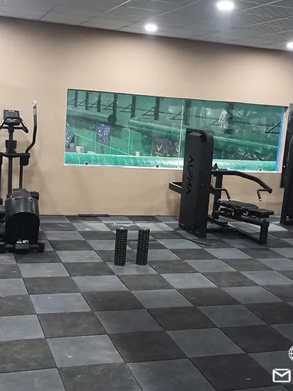 Our spacious and well-maintained gym floor, providing ample room for various exercises and ensuring a comfortable training environment.