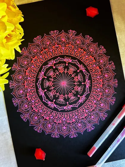In the mood for pink. This mandala uses shades of pink and orange to create a soft, radiant gradient. It’s a perfect example of how to blend colors with Gelly Roll pens.