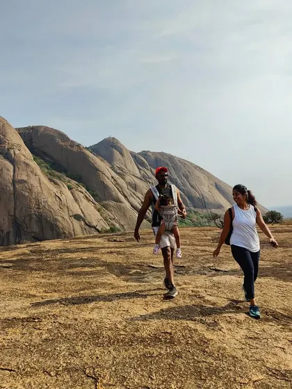 Our treks are for everyone, including families. It's amazing to see people of all ages enjoying the outdoors together on the rocky plains of Savandurga.