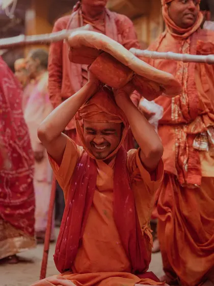 A comprehensive photo series from Lathmaar Holi in Barsana. These images document the unique tradition where women playfully hit men with sticks, recreating a legend of Lord Krishna and Radha. The photos are filled with motion, color, and raw emotion.