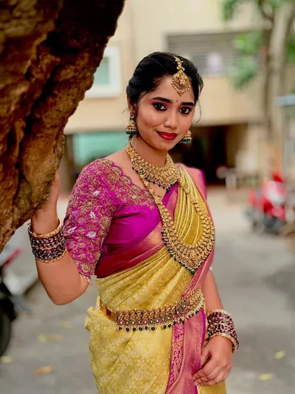 The intricate details of the antique jewellery set are clearly visible in this outdoor shot.