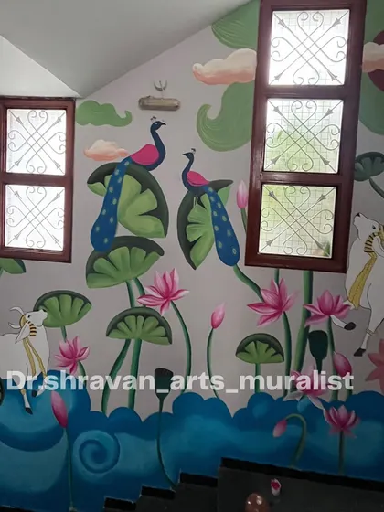 A Pichwai mural on a staircase wall. I designed the composition to work with the existing windows, creating a beautiful scene of cows and peacocks that unfolds as you climb the stairs.