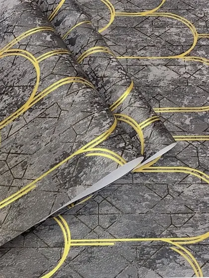 A dark grey version of the art deco scallop wallpaper, with bright yellow-gold lines creating a strong contrast.