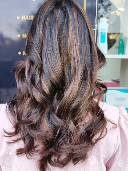 A beautiful example of our no-bleach highlights. This technique allows us to add rich, warm tones to the hair without causing damage.