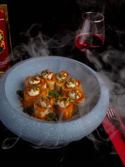 The epitome of culinary artistry. Our Chicken Beyti Kebab is a symphony of flavors, presented with dramatic flair to create a truly gastronomic bliss.