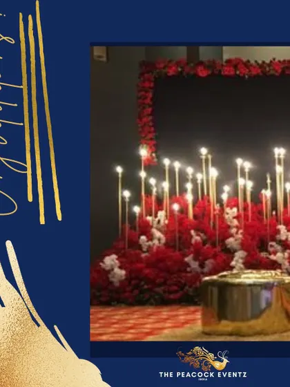 This red and gold theme is perfect for a vibrant Sangeet or cocktail party. The decor features a dramatic stage with a bed of red flowers and tall candle stands, creating a look that is both modern and luxurious.