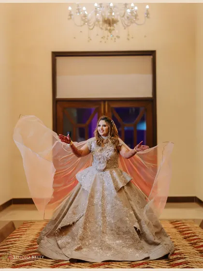 A beautiful full-length portrait of the bride in her stunning reception gown.