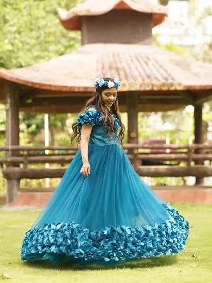 A closer look at the off shoulder design and 3D floral accents on this teal gown. Most of my rentals, including this one, come with complimentary accessories like this beautiful floral crown to complete your look without any extra hassle.