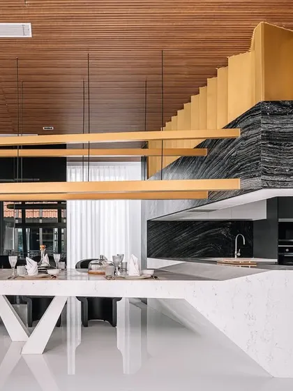The open-plan living and dining area in Tellado Villas is a study in material contrast and minimalist elegance. I used a thoughtful selection of stones and a soft wooden backdrop to create a space that feels both luxurious and contextually grounded.