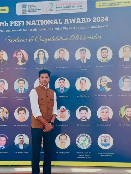 Standing in front of the wall of awardees at the PEFI National Awards. It is humbling to be included in such an accomplished group of coaches and sports professionals.