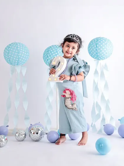 This is an individual portrait from a twins' second birthday session. We always make time to capture each child on their own, highlighting their unique personality and style.