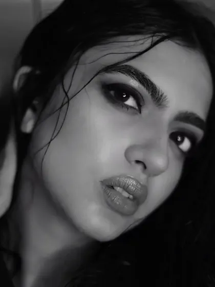 Another intense close-up of Kashika. The focus here is on the eyes, framed by bold brows and a deep, smokey shadow, demonstrating my skill in creating powerful, expressive eye makeup.