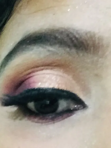 A close-up of a classic Indian bridal eye makeup look. I used a blend of warm pinks and shimmering gold eyeshadow to create a defined cut crease, finished with a sharp winged eyeliner. This technique makes the eyes the star of the show and photographs beautifully.