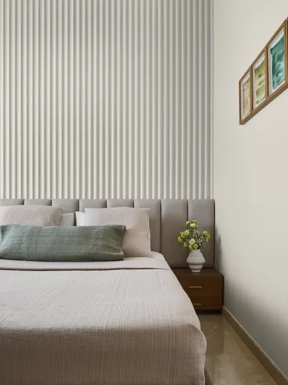 The Mirage Bedroom was designed as a serene guest retreat with a Japandi-inspired color palette. A fluted wall design behind the bed adds texture, while soft, neutral tones create a warm and welcoming ambiance.