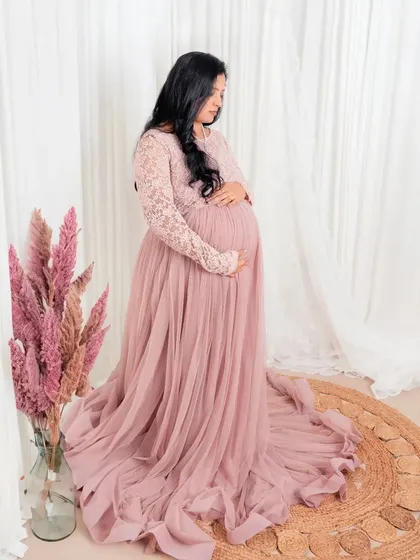 Another angle from this elegant maternity session, showing how the flowing dress and simple decor create a peaceful and beautiful atmosphere.