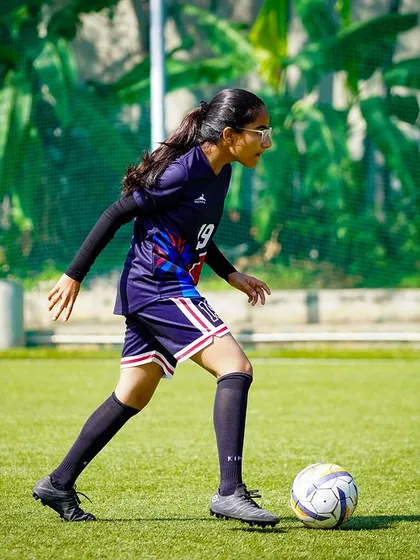 A player from Gopalan National School dribbles with purpose during the U-15 final of our inter-school tournament.