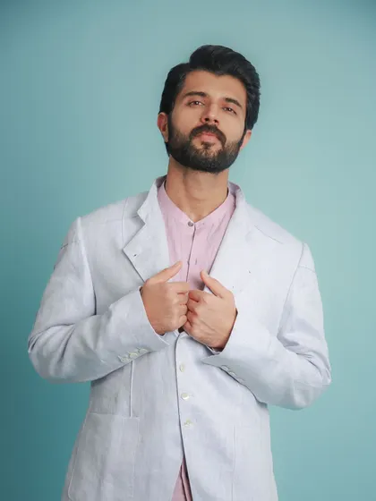 A portrait of Vijay, showing how the soft pastel colors complement his skin tone.