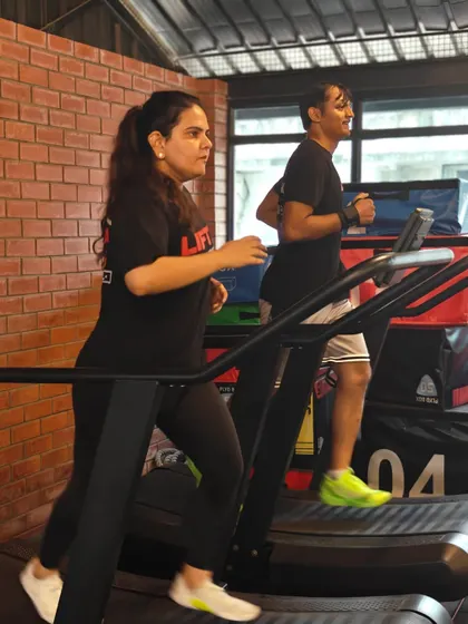 Locked in and focused. These shots capture the intensity and determination of our members during their workouts, from band work and deadlifts to dumbbell presses and rowing.