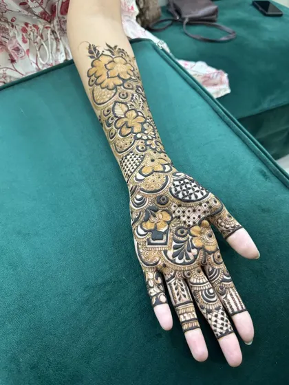 A clear shot displaying the complete henna design against a solid background, highlighting the clean lines and detailed patterns.