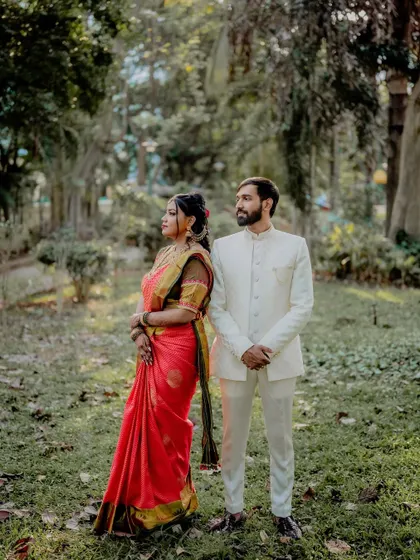 A slight variation in pose, showing the couple standing side-by-side. This formal portrait is perfect for capturing the elegance and grace of the wedding day.