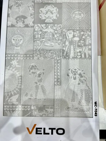 A close-up of a unique, traditional-patterned wallpaper or laminate sheet being considered for a project.