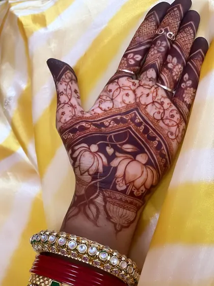 A perfect example of the deep, uniform stain you can expect from our natural henna. The bold lotus motifs and delicate vine work are beautifully defined by the rich color.