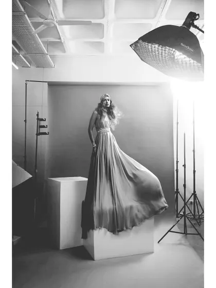 A behind the scenes shot showing my studio lighting setup. Understanding how to shape light is the most critical skill in photography. This black and white image shows the raw setup before the final magic happens.