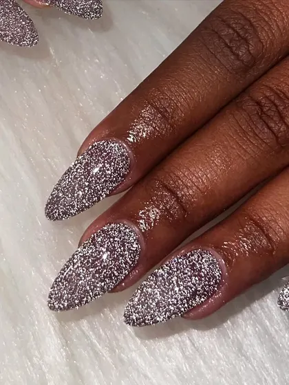 You can never go wrong with a full set of glitter nails. This reflective silver glitter gives off major sparkle and is perfect for a party or just because.