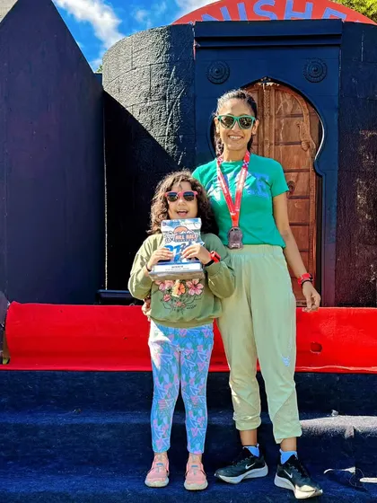 My first podium in a new age category at the Pune Hill Half Marathon, with my daughter there to celebrate.