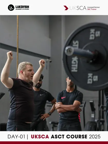 A UKSCA trainer demonstrates proper lifting posture to the group. Correct form is non-negotiable, and we ensure every participant understands the biomechanics before they coach others.