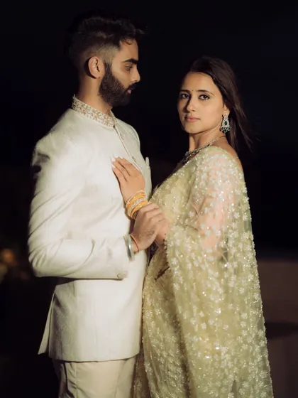 A dramatic and cinematic portrait against the night sky. This style is perfect for couples who want a touch of glamour.