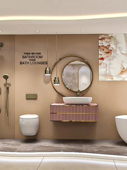 We believe in thinking beyond the bathroom to create 'Bath Lounges'. This space showcases a spa-like experience at home, featuring a freestanding tub, a floating vanity, and artistic wall decor, all tied together with soft, ambient lighting.