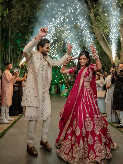 A grand Sangeet entrance with sparklers. We capture the energy and excitement of your celebrations, creating dynamic and memorable shots of your big moments.