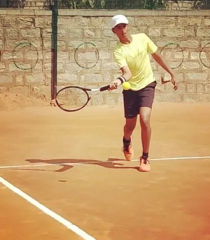 A junior player hitting a forehand volley during a UTR Tour match.