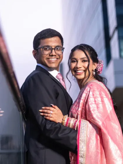 A beautiful couple portrait from a reception. I gave the bride a romantic, soft glam look with a pink lip and a floral hair accessory that complements her saree.