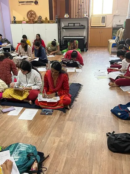A wide shot of our studio during the theory exams, filled with students from various batches focused on their papers.