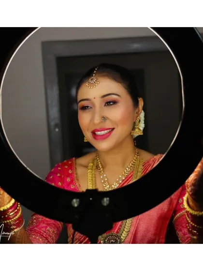 A happy bride posing with my ring light after her makeup is complete. Seeing my clients this happy and confident is the best part of my job.