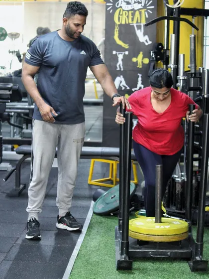 Start where you are, use what you have. I'm coaching a client on the sled push, a fantastic exercise for building full-body strength and conditioning.