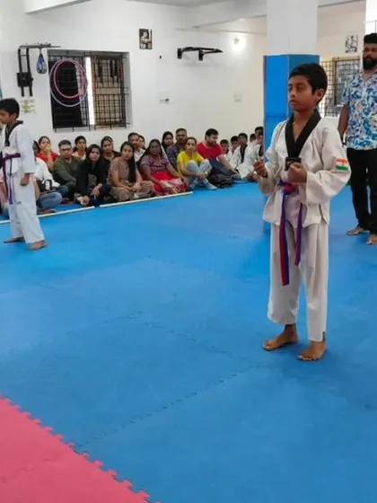 A student performs a kick during his belt exam.