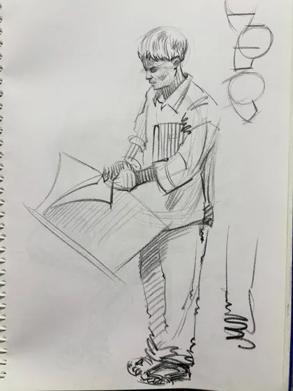 A sketch of a student reading, with construction lines for the head visible.