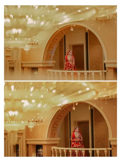 An artistic shot of the bride on a balcony, framed by the archway and out-of-focus chandeliers. This composition creates a sense of grandeur and a dreamy atmosphere.