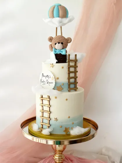 The full two-tiered version of the hot air balloon teddy bear cake, perfect for a larger baby shower celebration.