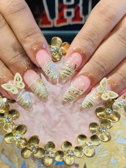 An example of my intricate 3D nail art. This design features delicate, hand-sculpted butterflies and fine gold threadwork on long acrylic extensions, perfect for a bride or a special occasion.
