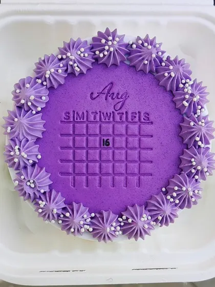 A "save the date" bento cake with a calendar design pressed into the fondant. A unique way to celebrate a special day.