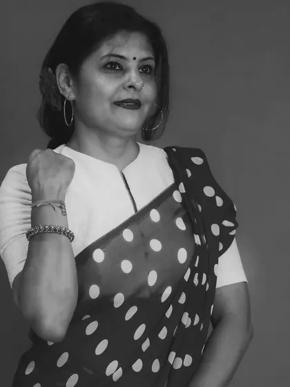A more serious, posed shot in the same retro outfit. The lack of color draws attention to the classic silhouette and pattern.