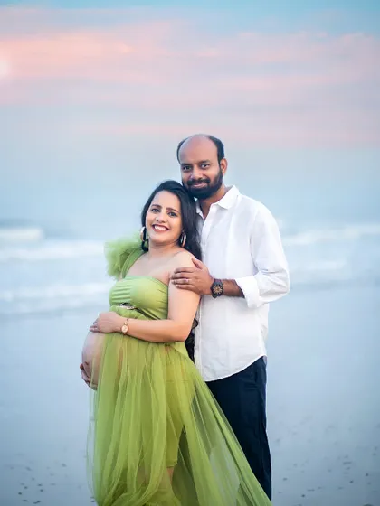 A classic portrait pose against the beautiful backdrop of the sea and sky. This shot perfectly balances the couple and the stunning natural scenery.