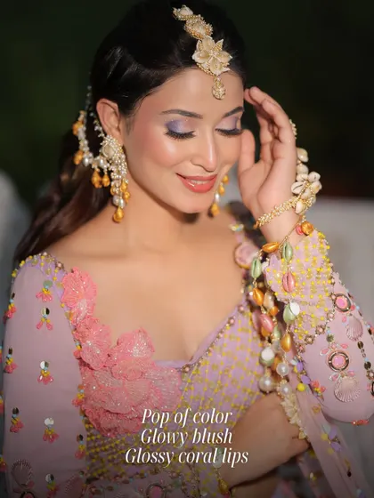 A fun and fresh look with a pop of color on the eyes, glowy blush, and glossy coral lips. This is perfect for a bride who wants to play with color for her pre-wedding events.